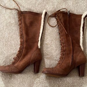 Camel colored, mid-calf height UGG lace-up front, zipper boots w/fur detail. Sz7